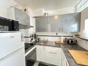 A compact kitchen with a microwave, toaster, sink, and a small oven. - 3 Pieces EN Duplex Calme Proche Croisette A2b234 (Cannes)