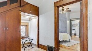 A bedroom with a bed, a desk, and a window. - Cozy North End Farmhouse  Easily Walk Downtown (Boise)
