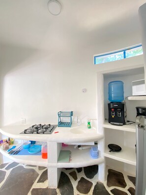 Fridge, microwave, stovetop, coffee/tea maker