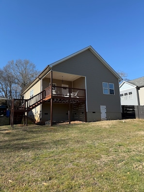 A two-story house with a covered porch and a fenced yard. - Greenville Gem: Family-Friendly + Pet-Friendly (Greenville)