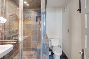 Shower, towels, soap, toilet paper