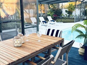 Outdoor dining - Tropical Oasis Modern Beach House w Pool near Clearwater - Two Primary Ensuites (Largo)