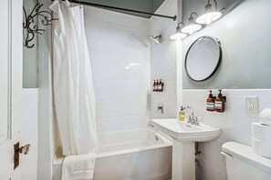 Shower, hair dryer, towels, shampoo