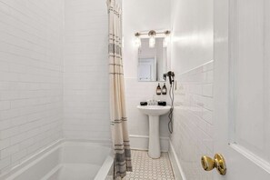 Shower, hair dryer, towels, shampoo