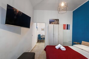 Apartamento família, vista para a cidade | Ferros/tábuas de passar roupa, Wi-Fi de cortesia