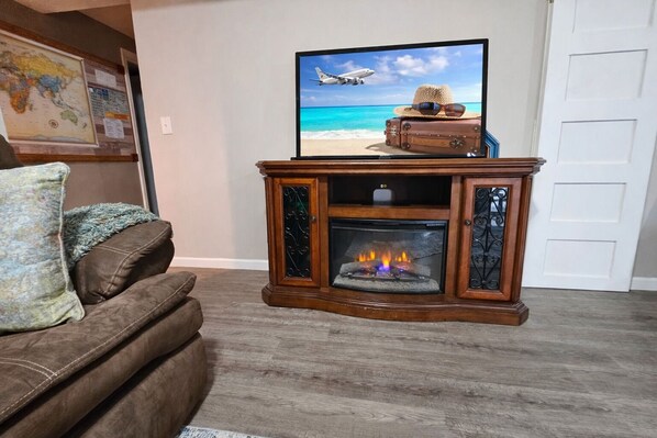 Smart TV, fireplace, books