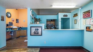 A reception area with a desk, computer, and a 'No Smoking' sign. - The Roosevelt Hotel & RV Park Gateway to Theodore Roosevelt National Park-Medora-on i-94 (Wibaux)