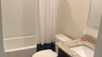 Shower, towels, soap, toilet paper