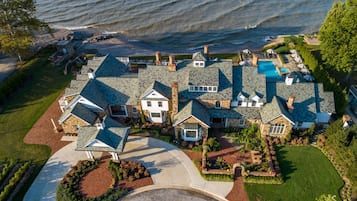 A large estate with multiple houses, a swimming pool, and a well-maintained garden.