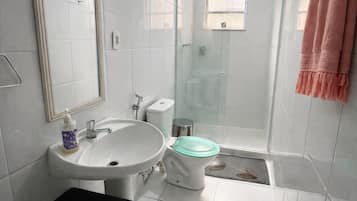 Shower, towels, soap, toilet paper