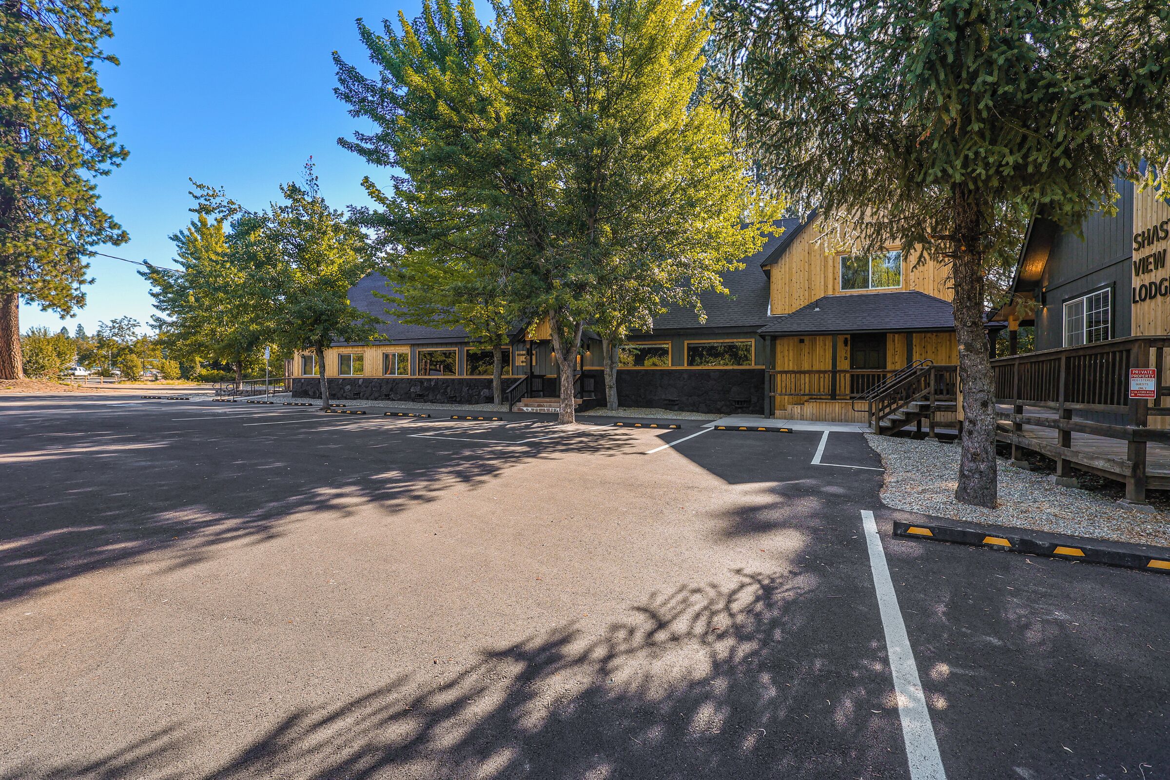 A parking lot with a building labeled "Shasta View Lodge" in the background.