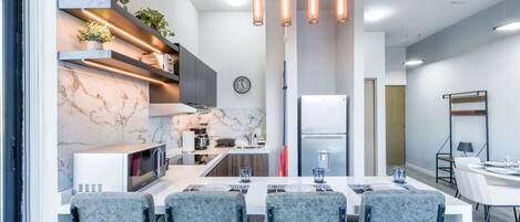 Fridge, microwave, stovetop, coffee/tea maker