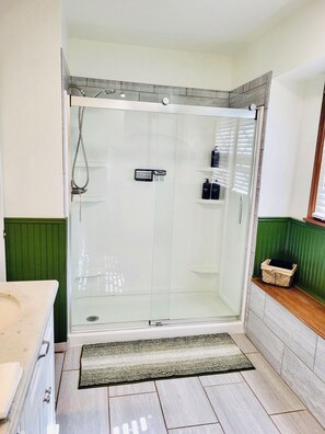Shower, hair dryer, towels, soap