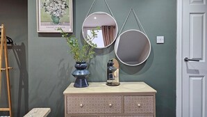 A room with a dresser, a framed artwork, and two wall-mounted mirrors. - 10% Off Weekly Stay|Chatsworth Retreat|Sleeps 7 (North Yorkshire)