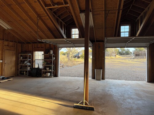 Escape to this “Country Manor” on almost 3 acres with incredible views.