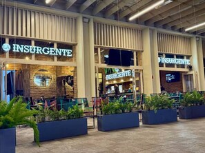 A building with multiple storefronts labeled "INSURGENTE." - Zapopan Centro +Cerca Basílica + Andares + Telmex (Zapopan)