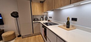 Fridge, microwave, oven, stovetop - Open Mind Property – New Build 1-Bed w/ Parking (Bournemouth, BH5 1AE)