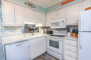 Private kitchen - Pelican Row: Steps to Sand • Pool • Affordable, Family Friendly, Beach Getaway (Atlantic Beach)