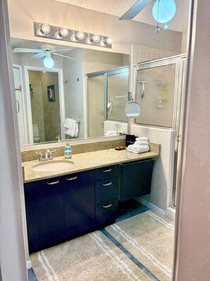 Shower, hair dryer, towels, soap