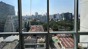 A high-rise building with multiple floors and large windows. - Studio/Loft Apartment in Vitant by BeGrand Anahuac, close to Polanco. (Ciudad de México)