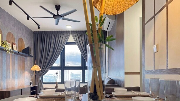 A dining area with a long table set for two, a ceiling fan, and a large window with curtains. - Ancestry 3BR @ M Vertica | MRT Access+Netflix+WiFi (Cheras)