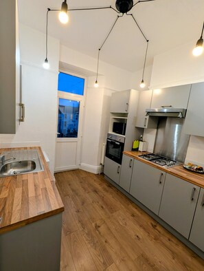 Fridge, microwave, oven, stovetop - Central Boutique 3 Bed Apartment | Habita Property (Mannamead)