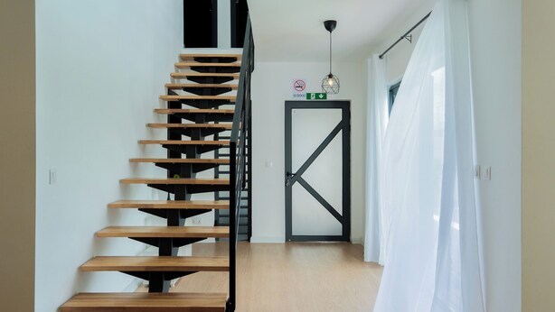 A modern staircase with wooden steps and a metal railing, leading to a door with a "No Smoking" sign above it. - Villa Aaya Grand Baie, Private Pool,3 Bedrooms, 7 mins to Pereybere beach (Moka District)