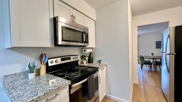 Dishwasher, coffee/tea maker, cookware/dishes/utensils