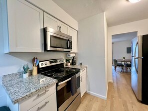 Dishwasher, coffee/tea maker, cookware/dishes/utensils