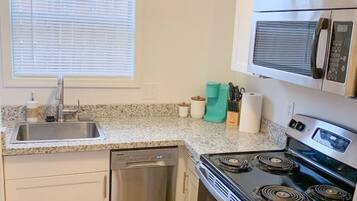 Dishwasher, coffee/tea maker, cookware/dishes/utensils