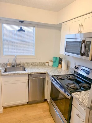 Dishwasher, coffee/tea maker, cookware/dishes/utensils