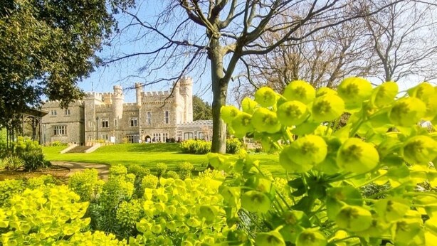 A historic building with a large lawn and a prominent tree in the foreground. - Whitstable Neptune - Alberta Holiday Park (Whitstable)