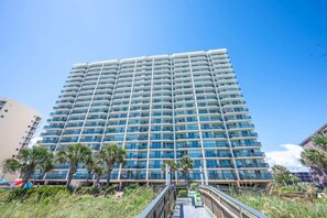 A multi-story hotel with a modern design, featuring balconies and a central atrium. - Private Ashworth Resort Direct Oceanfront View New (North Myrtle Beach)