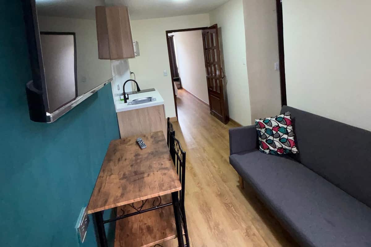 Family Apartment | Living area | 42-inch Smart TV with digital channels, Netflix, streaming services