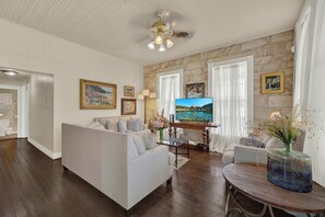 House, Multiple Beds, Balcony (101 N Orange - Combo) | Living area - Two Suite Getaway With Balcony Overlooking Main St (Fredericksburg)