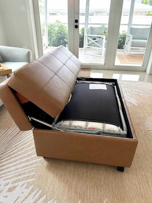 A convertible sofa with a cushioned top and a storage compartment underneath. - 2 Bedroom on the Barrier Island. Walk to the Beach (Fort Lauderdale)
