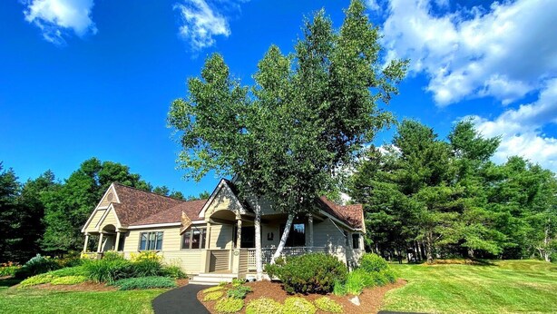 A two-story house with a front porch, a driveway, and a large tree in front. - Fv49 Wow Stunning Single Level Home Next to Golf Course and Mt Washington Hotel (Bretton Woods)