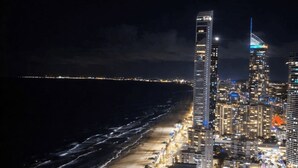 A high-rise hotel with multiple floors, a prominent vertical design, and a beachfront view. - Level 42 Beachside 1BR Apartment with Ocean Views (Surfers Paradise)