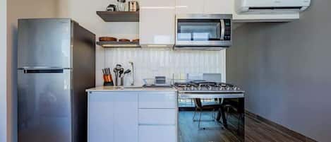 Coffee/tea maker, fridge, microwave, oven