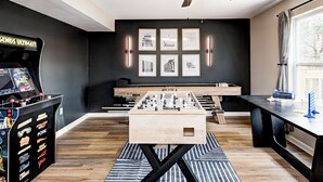 A room with a foosball table, a foosball table on a stand, a foosball table on a table, a foosball table on a table, a foosball table on a table, a foosball table on a table, a foosball table on a table, a foosball table on a table, a foosball table on a table, a foosball table on a table, a foosball table on a table, a foosball table on a table, a foosball table on a table, a foosball table on a table, a foosball table on a table, a foosball table on a table, a foosball table on a table, a foosball table on a table, a foosball table on a table, a foosball table on a table, a foosball table on a table, a foosball table on a table - Shuffleboard~Hot Tub~Arcade~Foosball~Spacious for Groups~7 Min to Ruoff (Noblesville)
