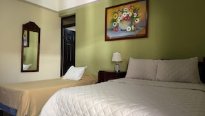 A hotel room with two beds, a nightstand with a lamp, a painting on the wall, and a door leading to another room. - Hotel Vizcaino Leon (Leon)