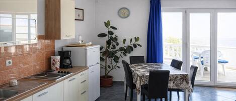 Fridge, microwave, stovetop, coffee/tea maker