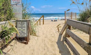A beach path leading to the ocean with a sign prohibiting beach fires or fireworks. - SNOW GOOSE - 4 BR Semi-Oceanfront Home, Just 1 Lot From The Ocean (Duck)