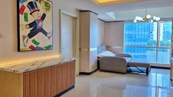 Apartment, 3 Bedrooms, City View | Living area | 43-inch plasma TV with cable channels