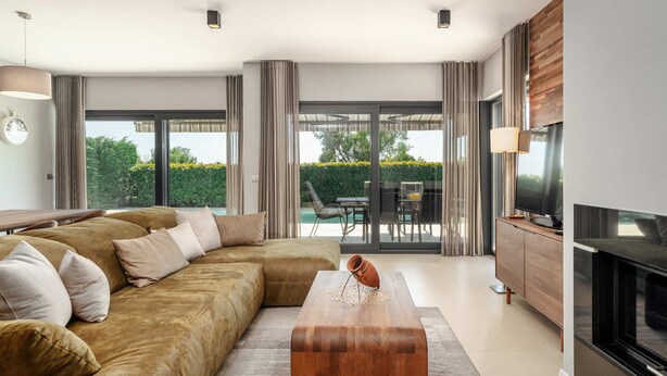 A modern living room with a sofa, a coffee table, a TV, and a fireplace. - Villa Rose (100541-K1) - Porec (Porec)