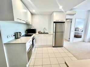 Fridge, microwave, oven, stovetop - 1 Bed Apartment on Palmer St (South Townsville)