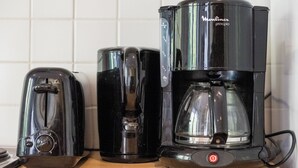 Three black coffee makers on a countertop. - Prime Location Apartment Châtelain Saint-gilles Quiet & Central (Brussels)