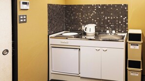 A compact kitchenette with a microwave, coffee maker, and a sink. - Nonsmoking Rinn Manjuji for 1 person Room only / Kyoto City Kyōto (Kyoto City)