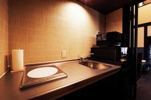 A modern bathroom with a sink, a toilet paper holder, and a microwave. - Nonsmoking Rinn Tenjincho for 2 person Room only / Kyoto City Kyōto (Kyoto City)