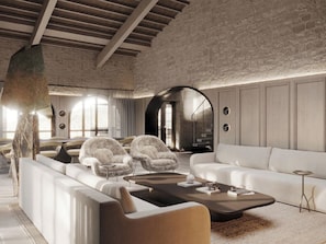A modern living room with a white sofa, armchairs, and a coffee table. - Chapter Chianti (Cavriglia)